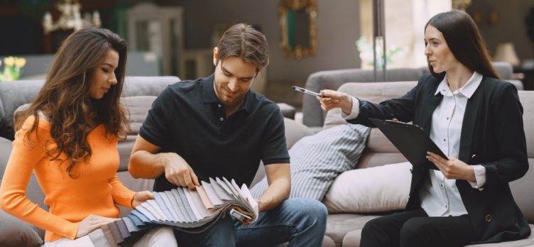 Couple selecting fabric at furniture store 1