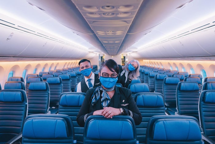 United economy masked flight attendants