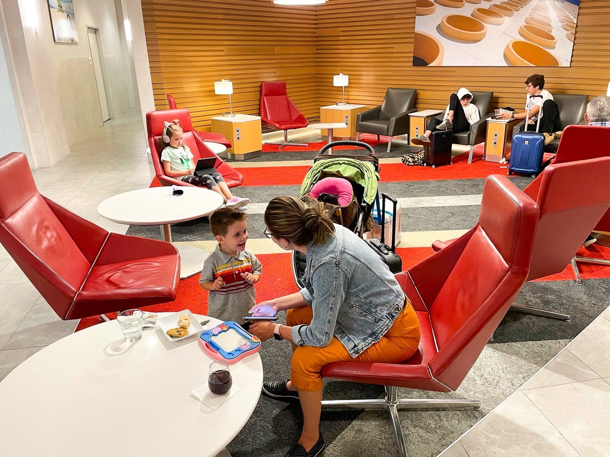 Family Walking Through Burlington International Airport BTV Vermont Admirals Club Miami International Airport Family sitting