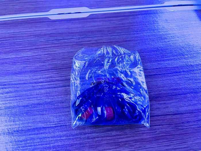 American Airlines First Flagship Business Class Miami to Boston earbuds headphones