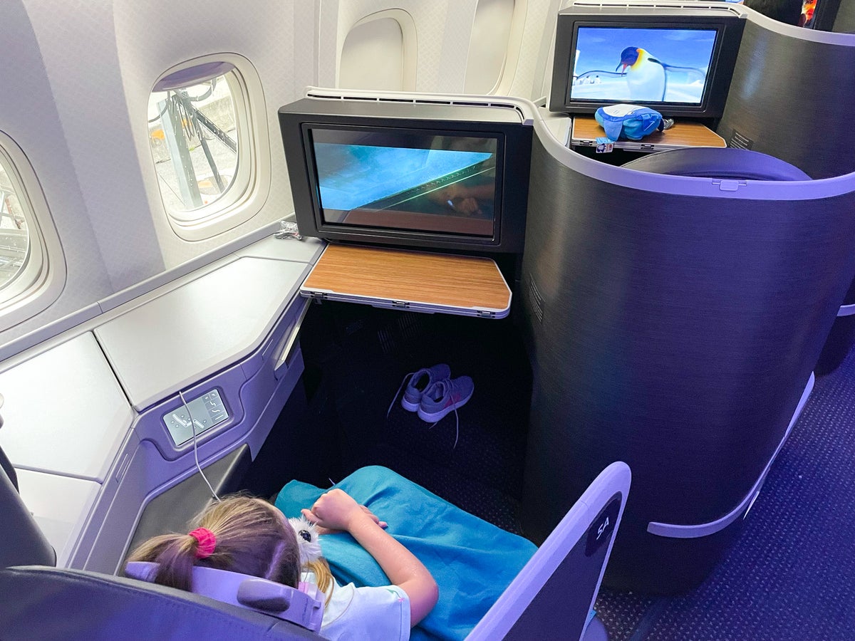 American Airlines First Flagship Business Class Miami to Boston girl watching a movie