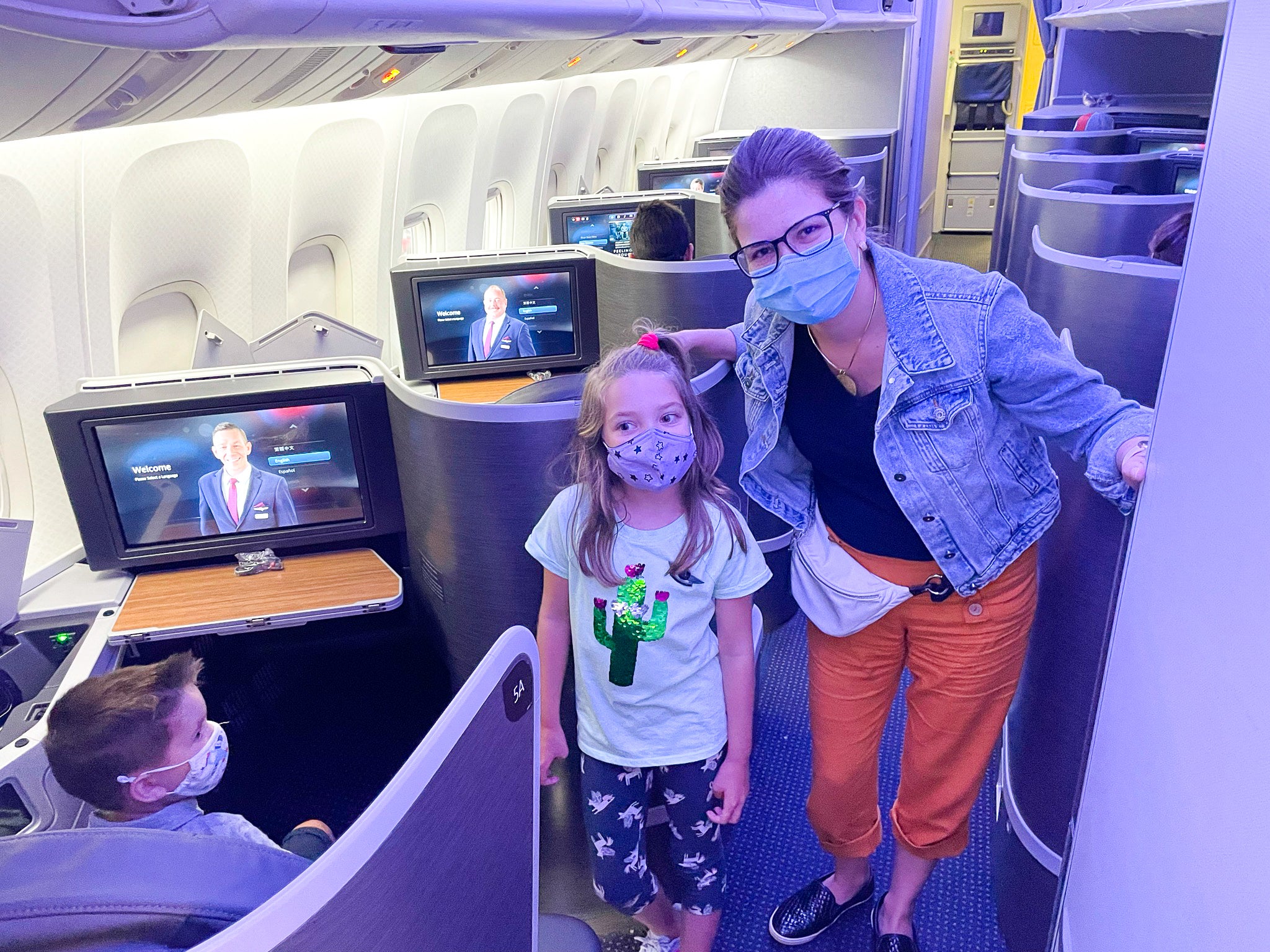 American Airlines First Flagship Business Class Miami to Boston mom and daughter in masks