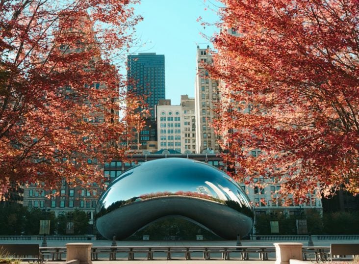 Cloudgate The Bean in Chicago Illinois during foliage season Cloudgate The Bean in Chicago Illinois during foliage season