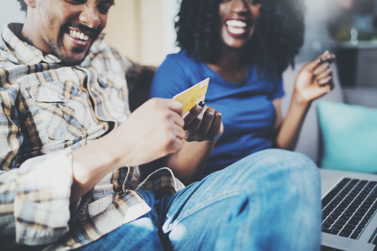 Couple on laptop with credit card shopping