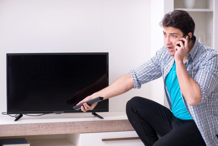 TV Man trying to fix broken tv