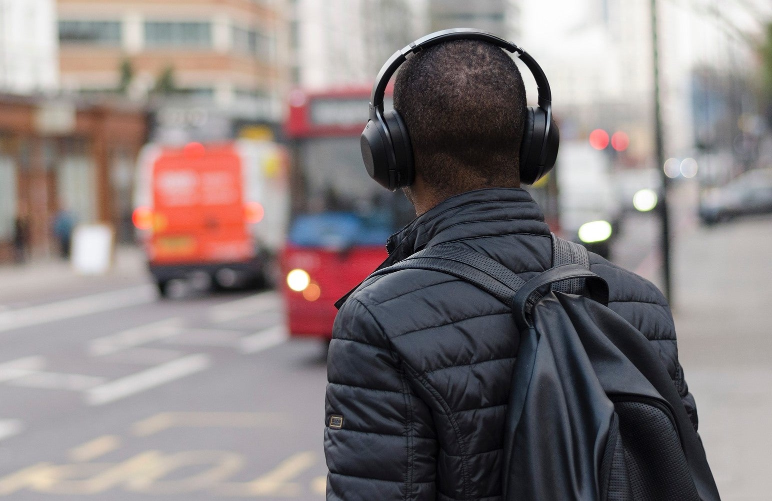 Man with headphones and backpack