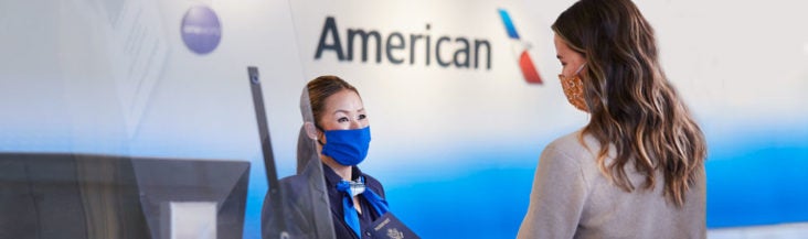 American Airlines agent and passenger American Airlines agent and passenger