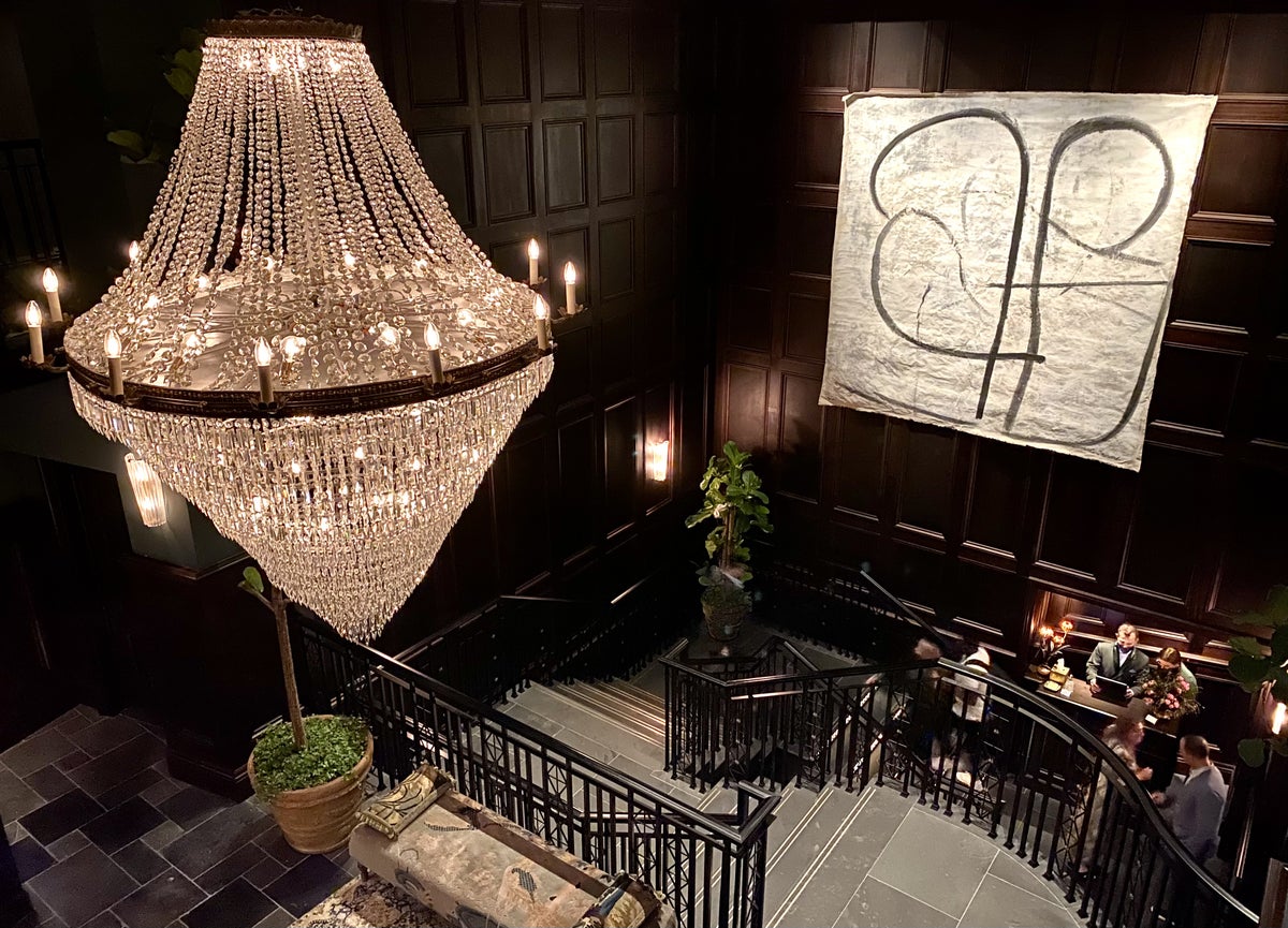 The NoMad London chandelier and stairway