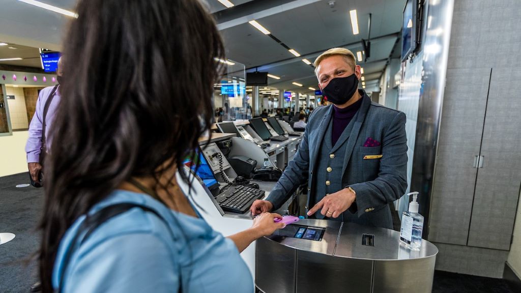 Delta passenger scans boarding pass on phone