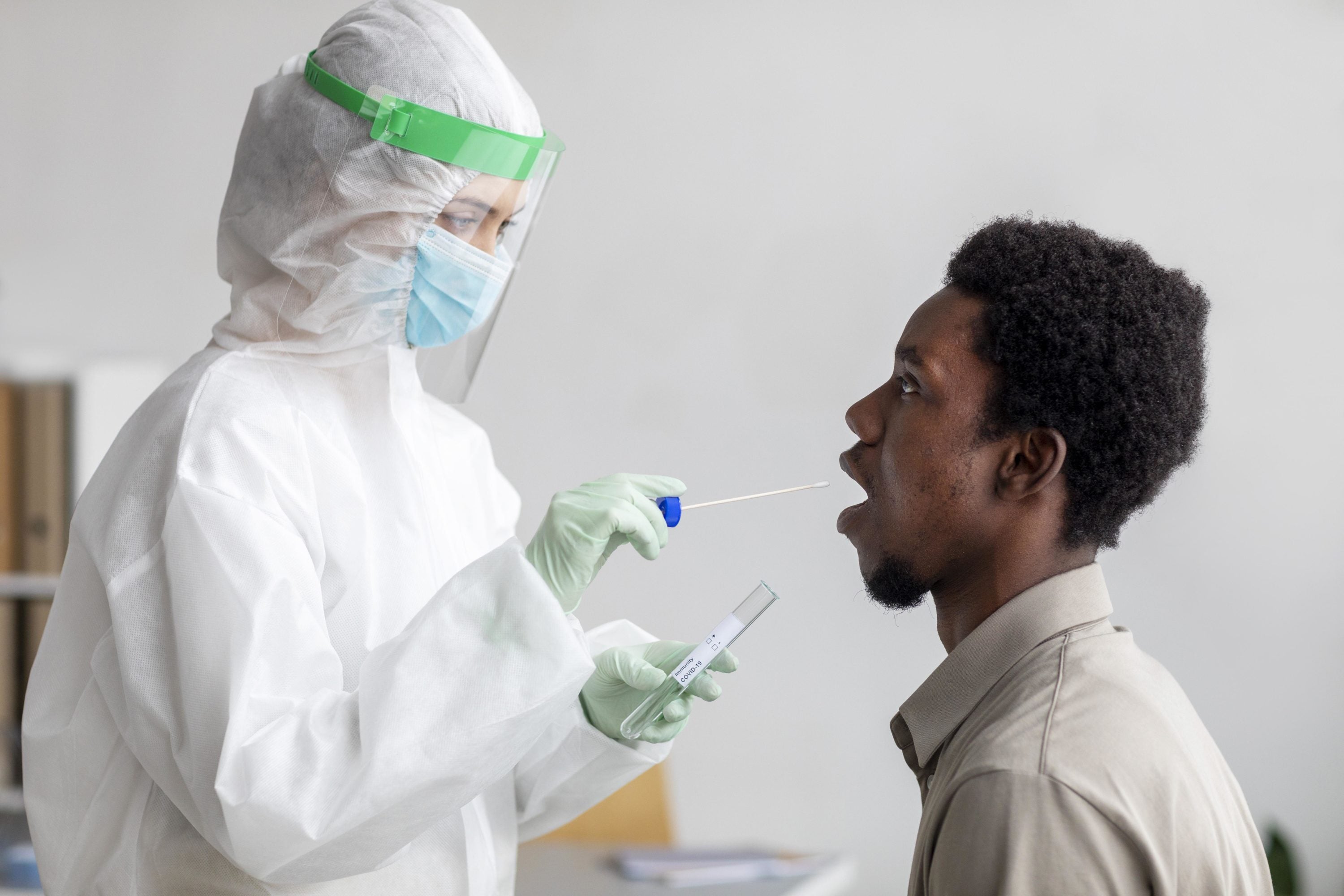 doctor taking coronavirus test sample