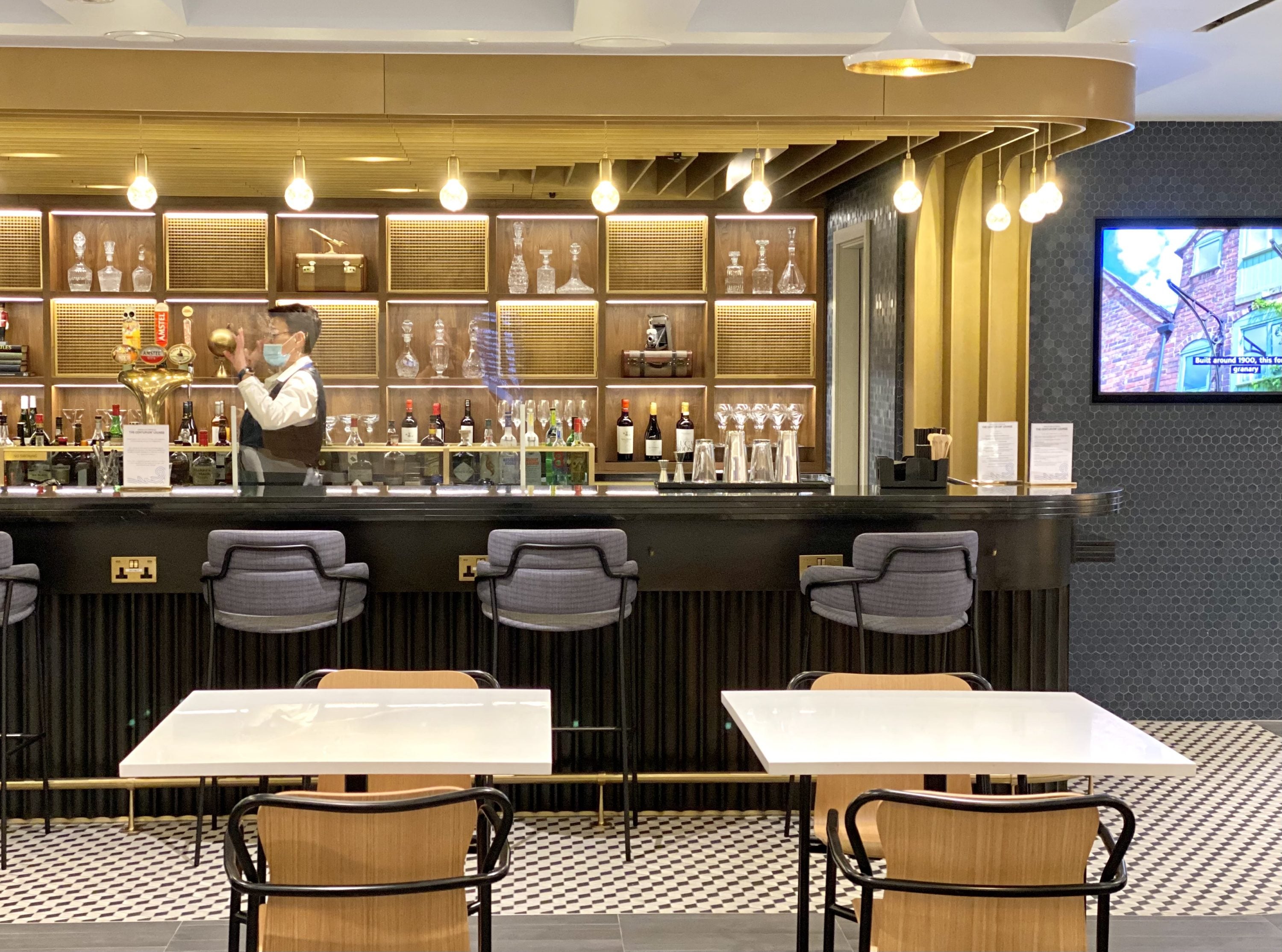 American Express Centurion Lounge Heathrow Terminal 3 dining tables in bar area
