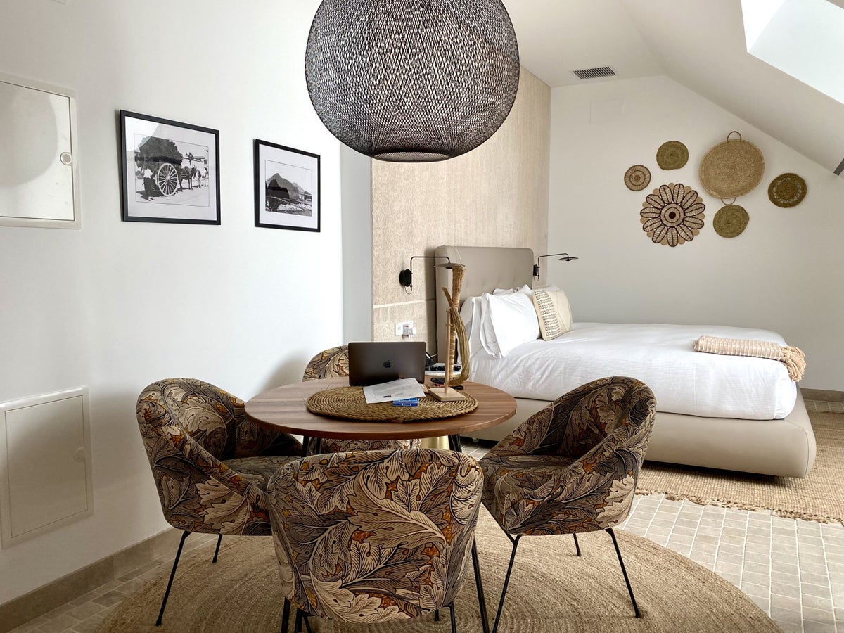The Atocha Hotel Madrid Tapestry Collection by Hilton El Atochal Penthouse dining area and bedroom