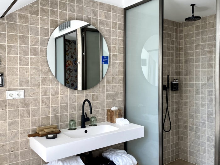 The Atocha Hotel Madrid Tapestry Collection by Hilton El Atochal Penthouse sink area and shower room