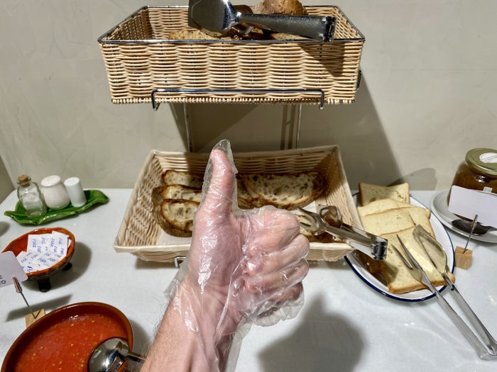 The Atocha Hotel Madrid Tapestry Collection by Hilton plastic gloves at breakfast
