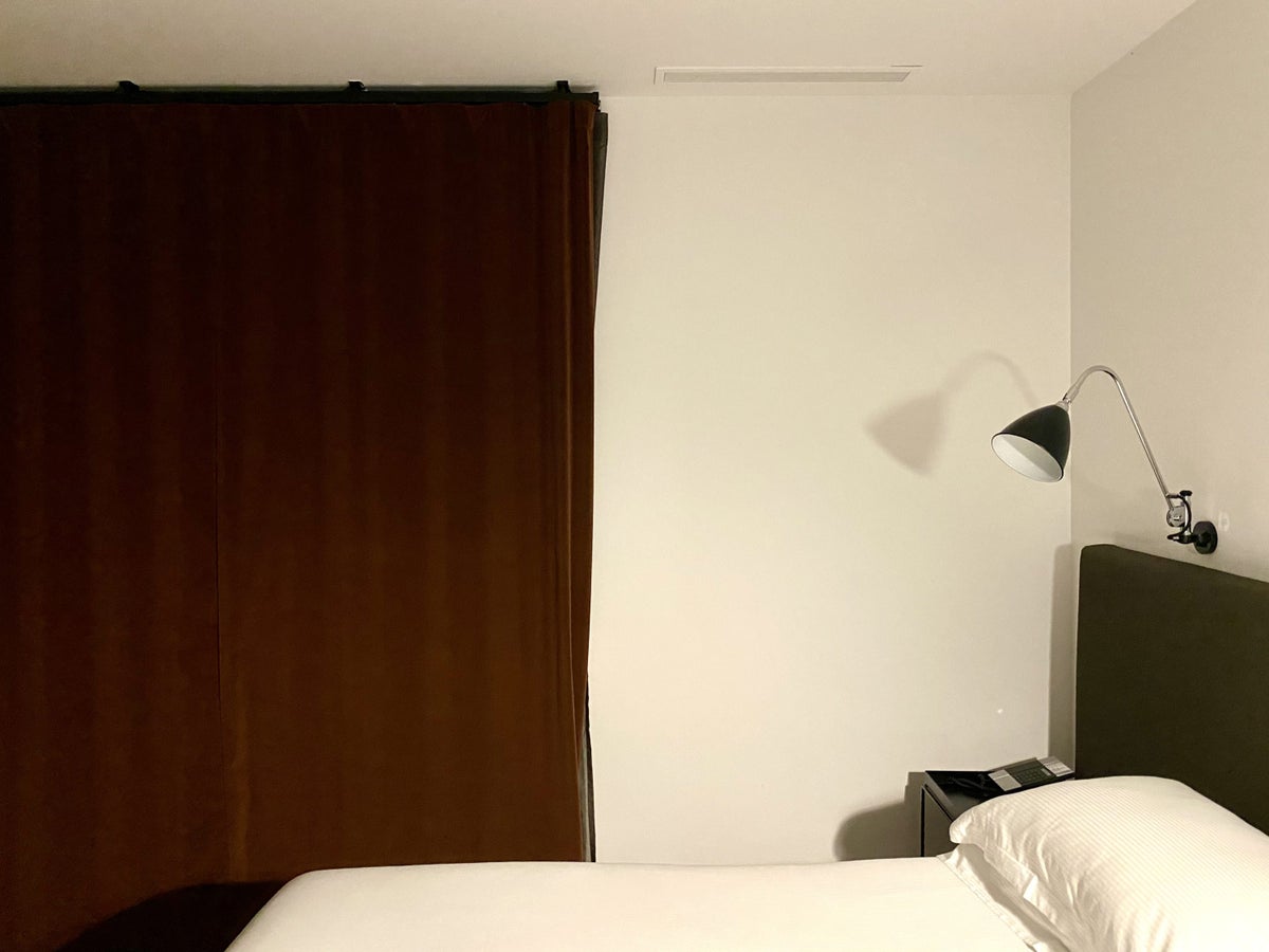 Alexandra Hotel Barcelona Curio Collection by Hilton bed by night