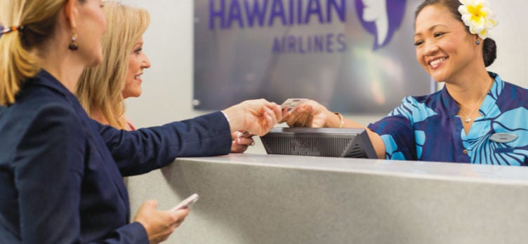 Hawaiian Airlines customers check in gate