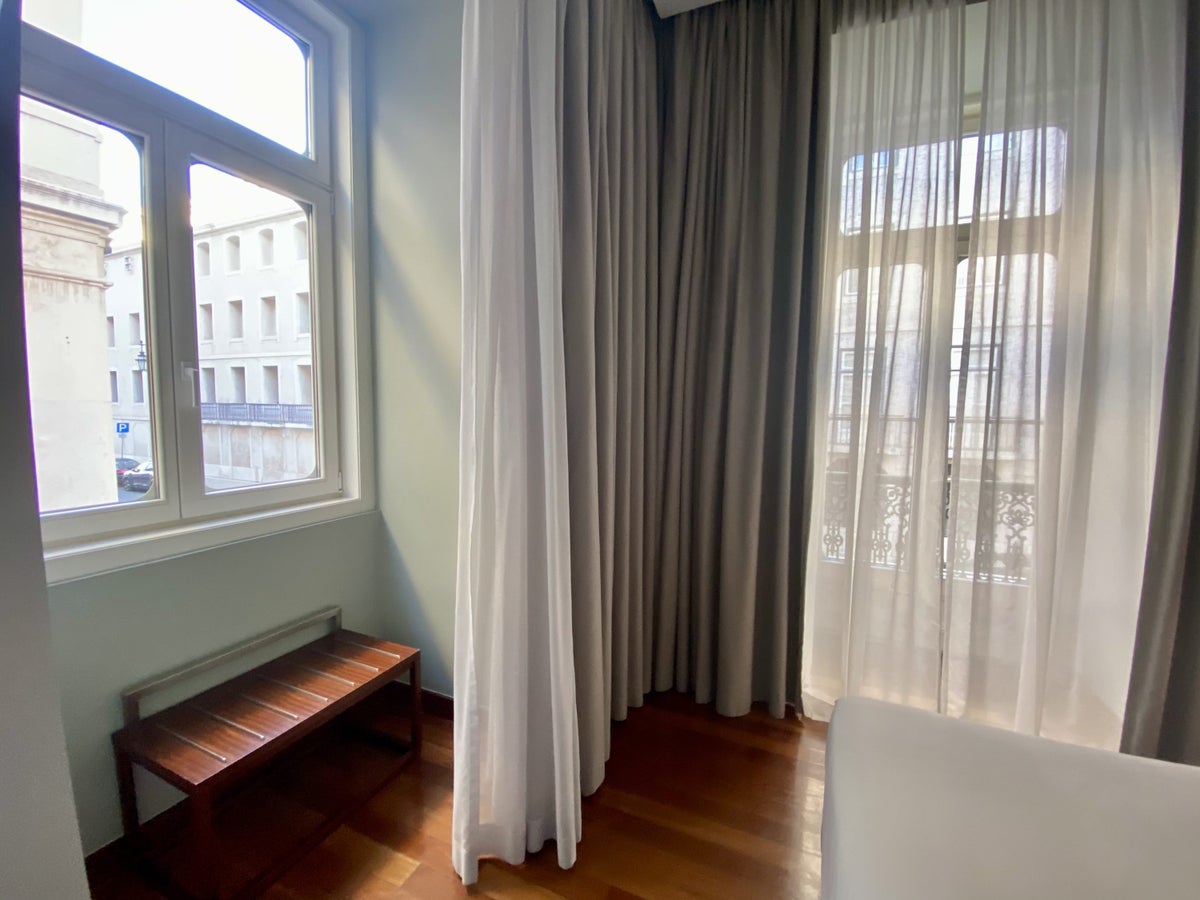 Pousada de Lisboa Small Luxury Hotels of the World bedroom luggage rack and windows