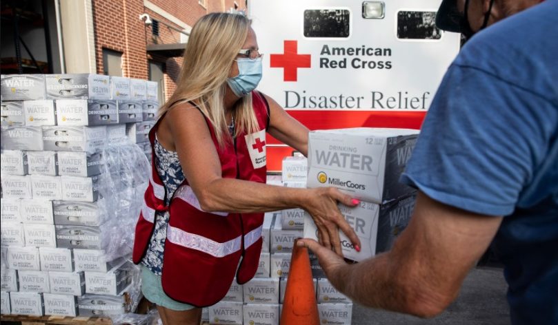 Red Cross Delivering Water