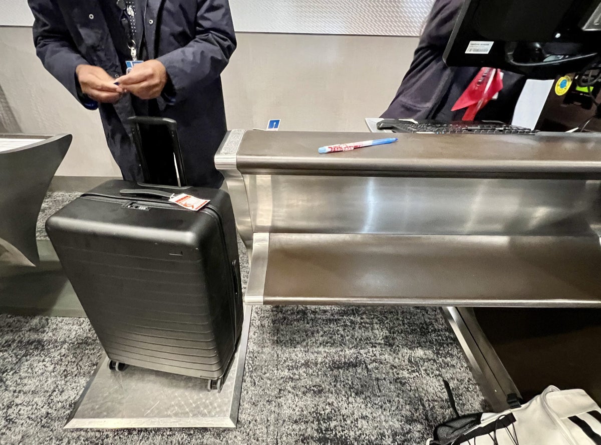 American Airlines Flagship First LAX case weighing and tagging