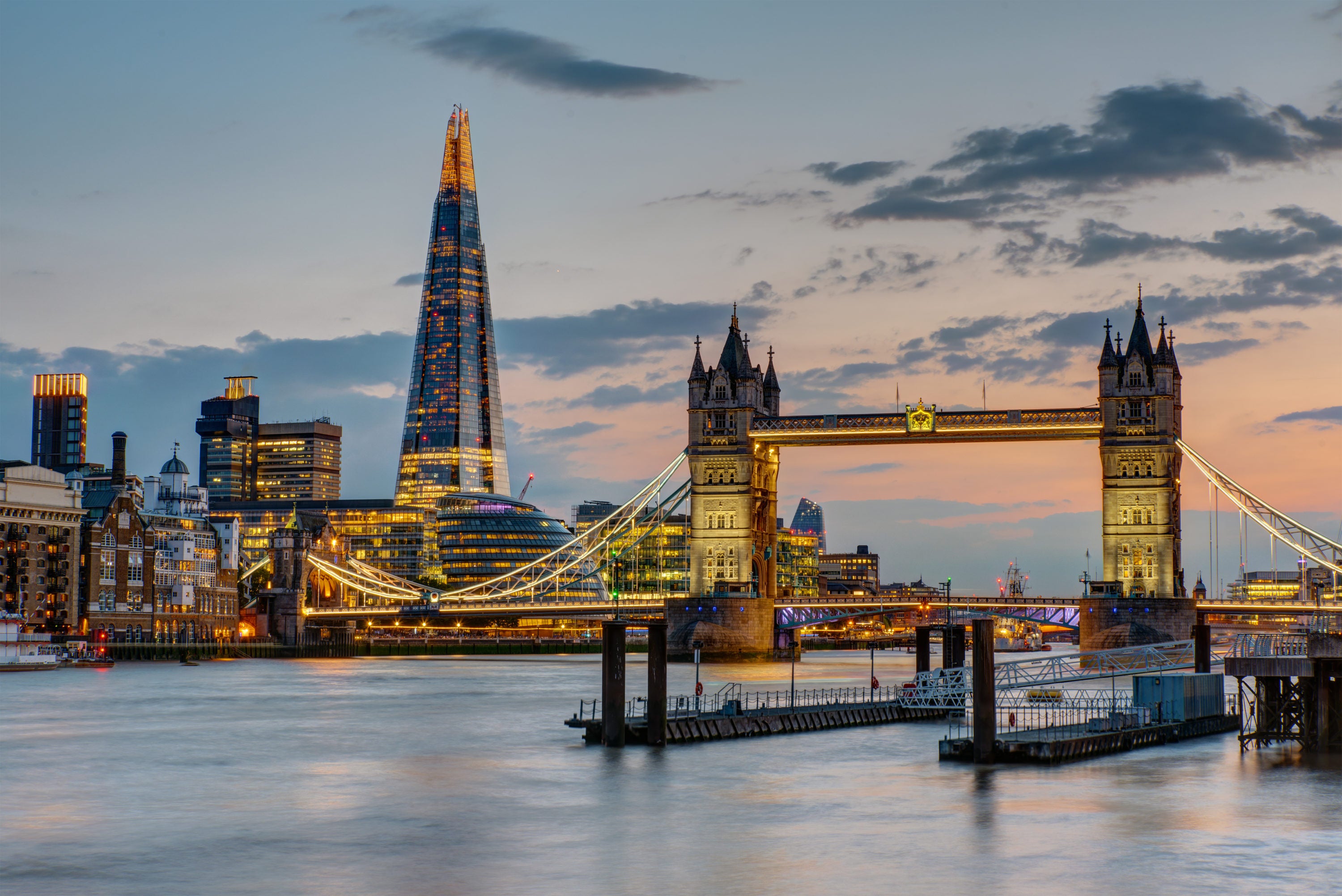 The Tower Bridge in London after sunset with the Shard in the back