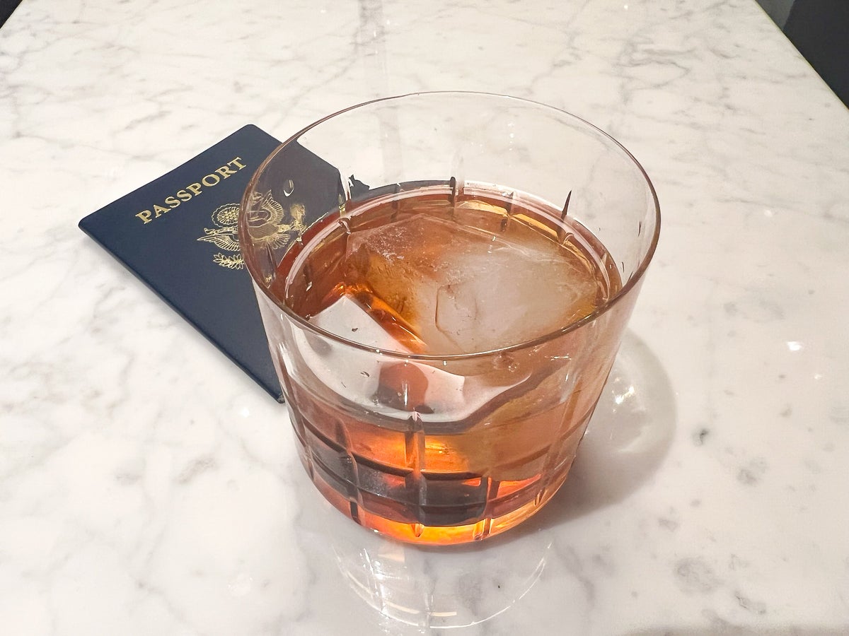 United Polaris Lounge Houston IAH cocktail and passport