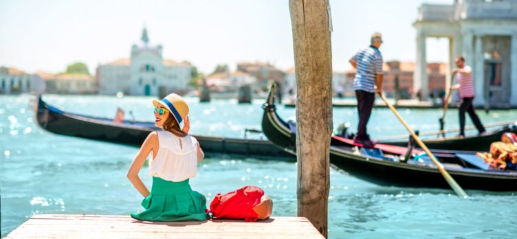 Woman watching Venice gondolas