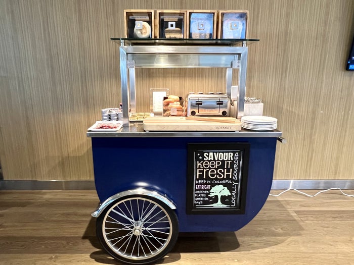 British Airways Boeing 777 300 Club Suite JFK Galleries Lounge toast and bagel cart