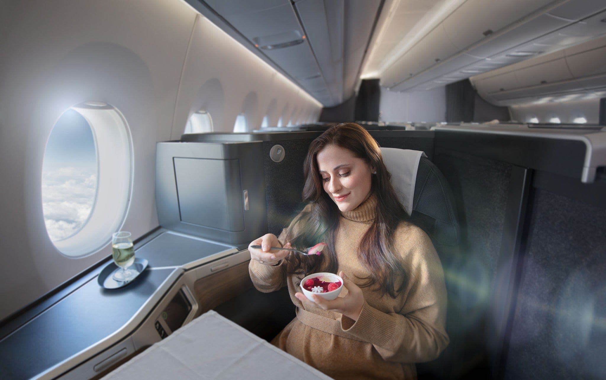 British Airways Club Suite woman eating dessert