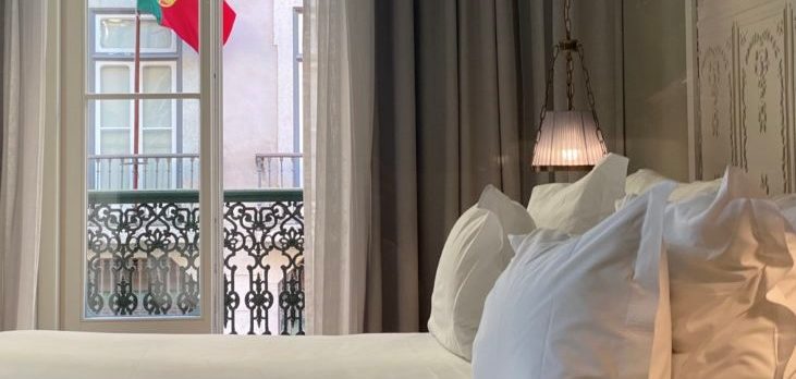 Pousada de Lisboa Small Luxury Hotels of the World bedroom Portuguese flag