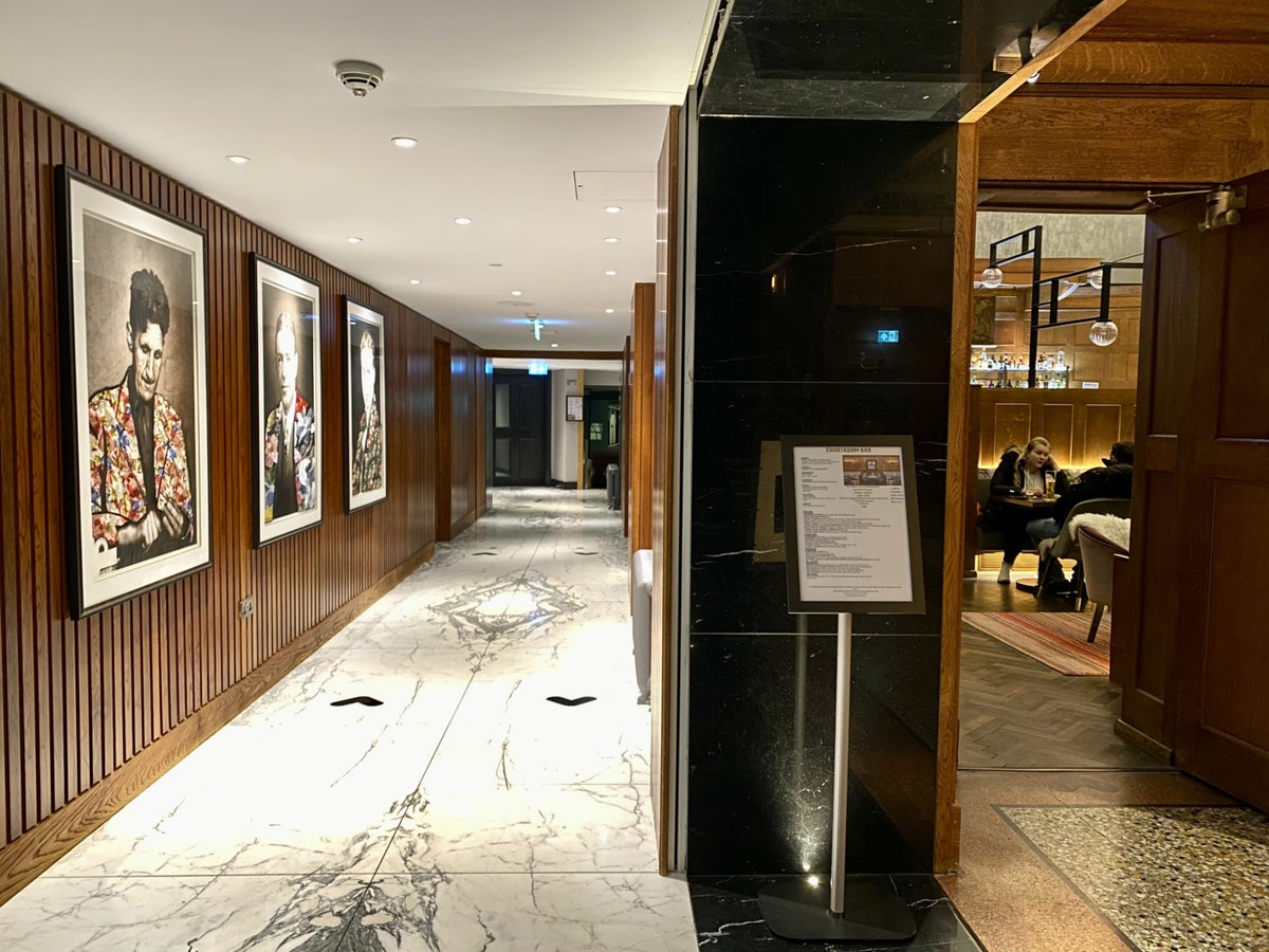 The Dixon London Autograph Collection Courtroom Bar entrance and corridor to restaurants