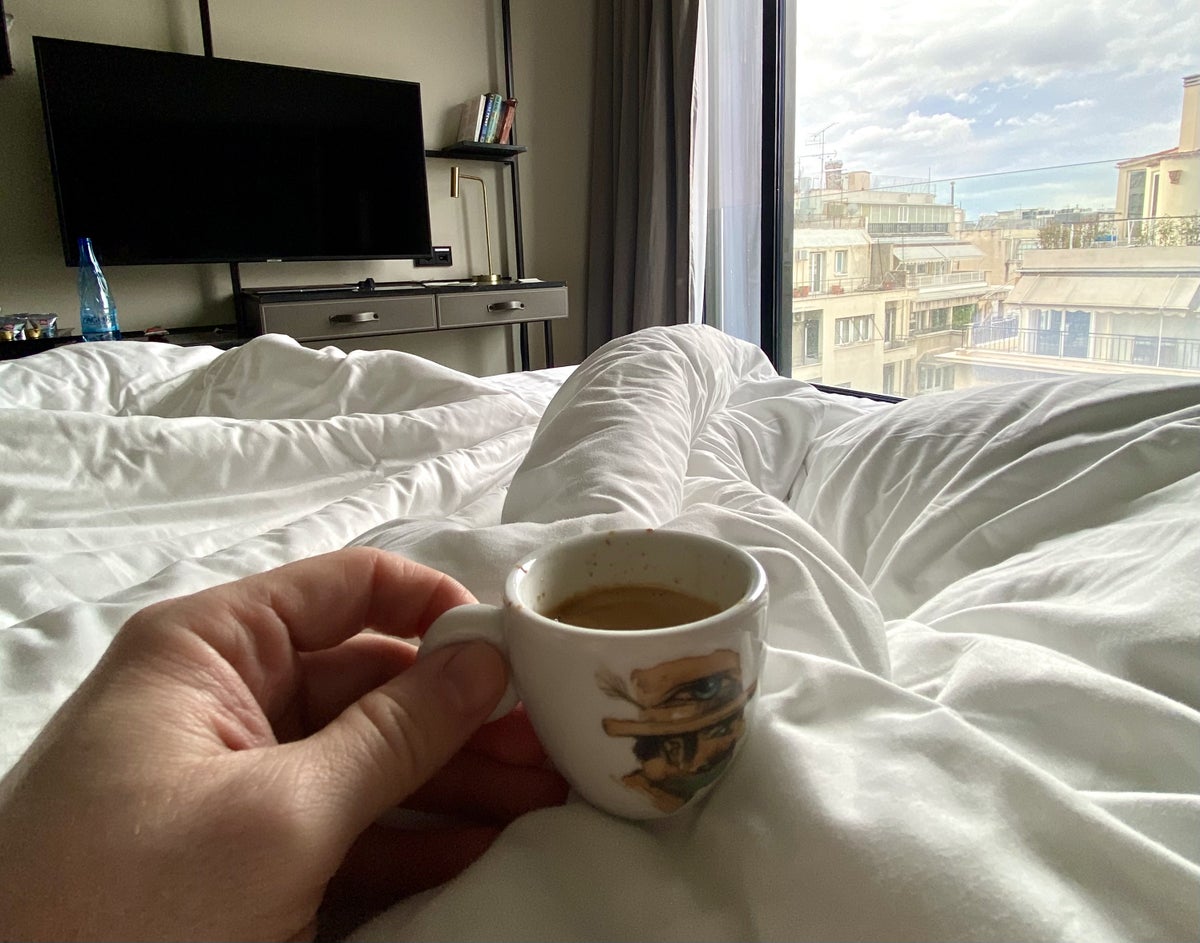Academias Hotel bedroom espresso in bed