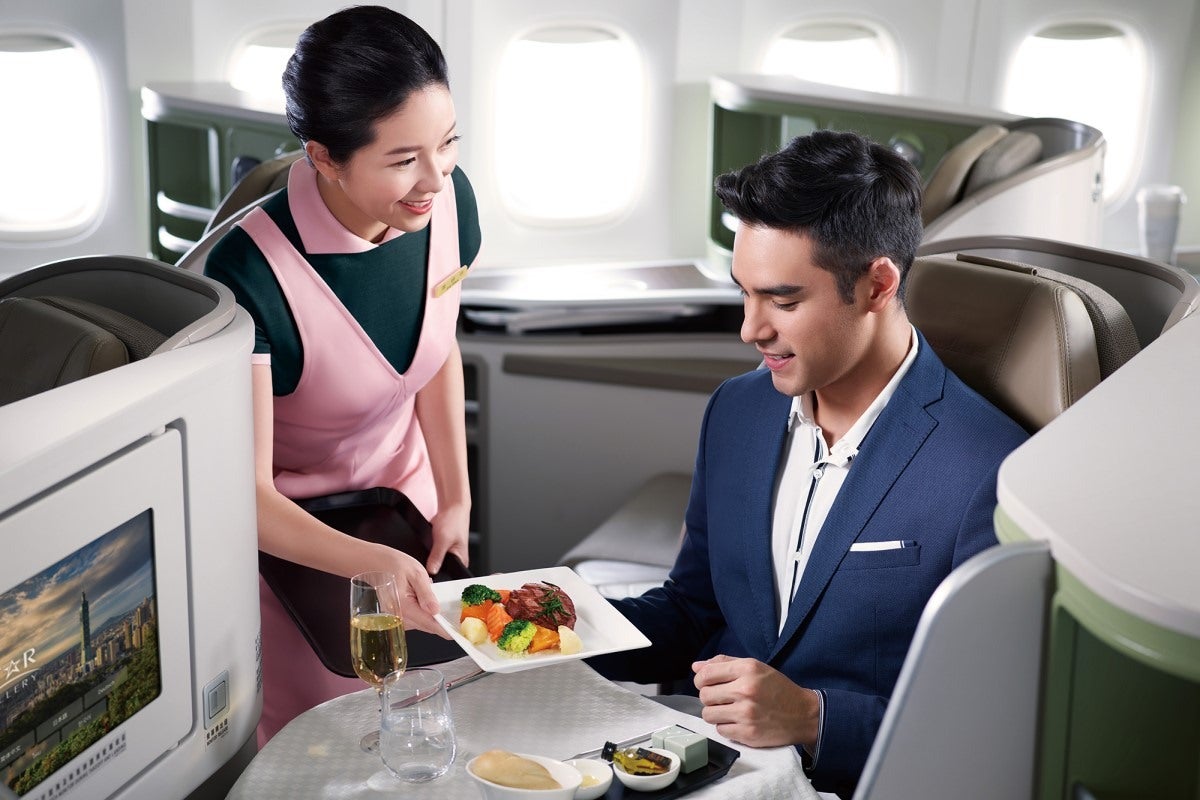 Eva Air Royal Laurel Class business passenger with meal