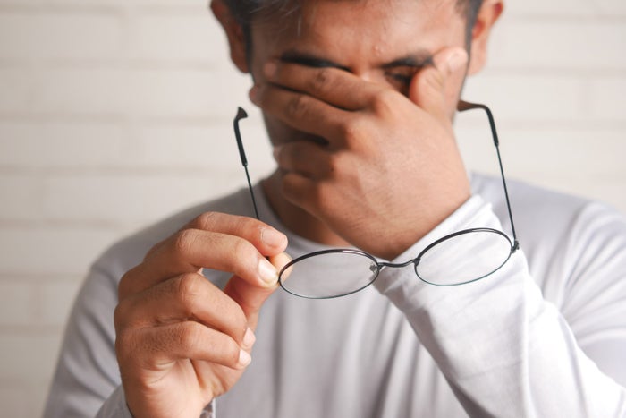 Frustration Frustrated man removing glasses