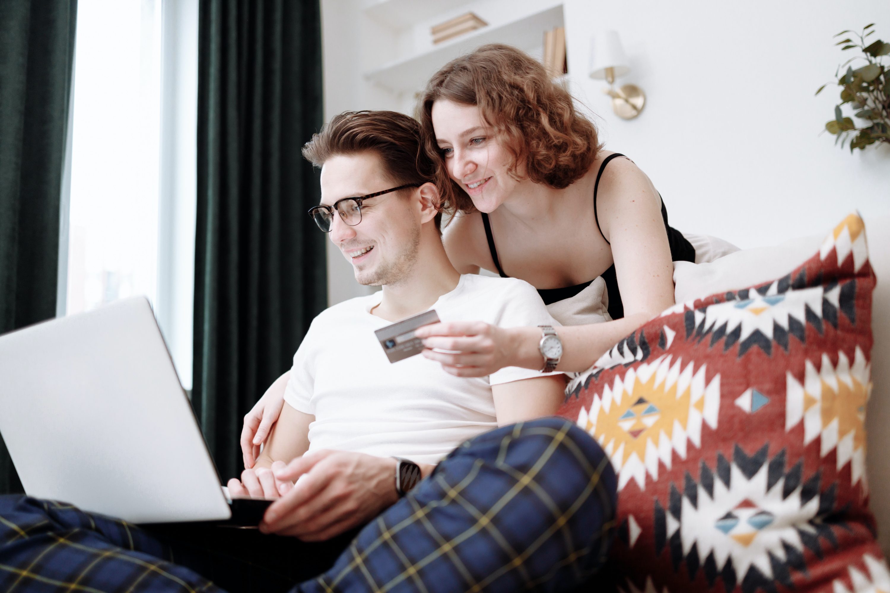 Couple on laptop with credit card