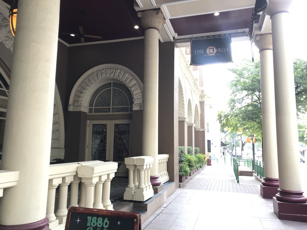Sidewalk next to the 1886 Cafe Patio and Driskill Hotel