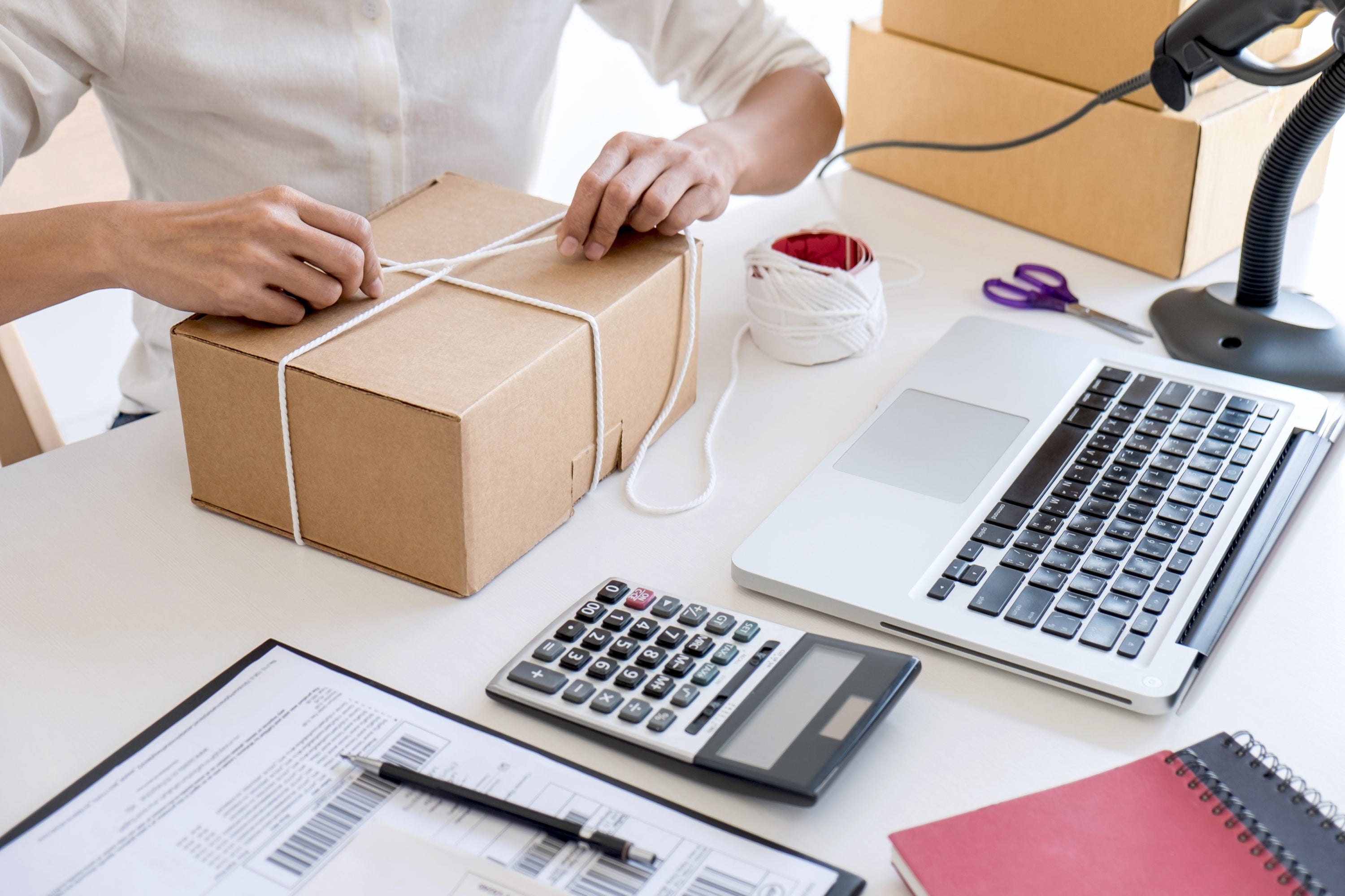 Shipment Online Sales, Small business or SME entrepreneur owner delivery service and working packing box, business owner working checking order to confirm before sending customer in post office.