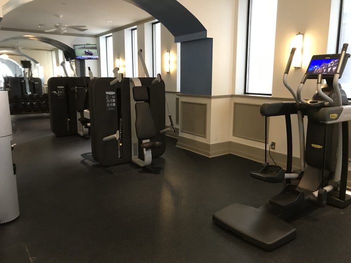 Weight and elliptical equipment at The Driskill Hotel gym.