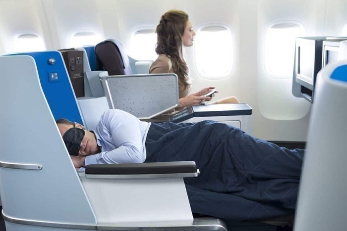 KLM business class male passenger lie flat KLM business class male passenger lie flat
