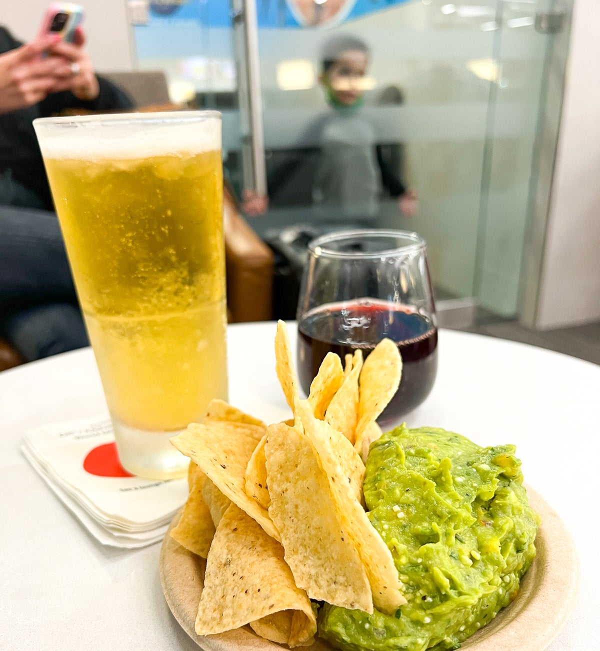 Wine beer and guacamole at the Admirals Club at Boston Logan International Airport