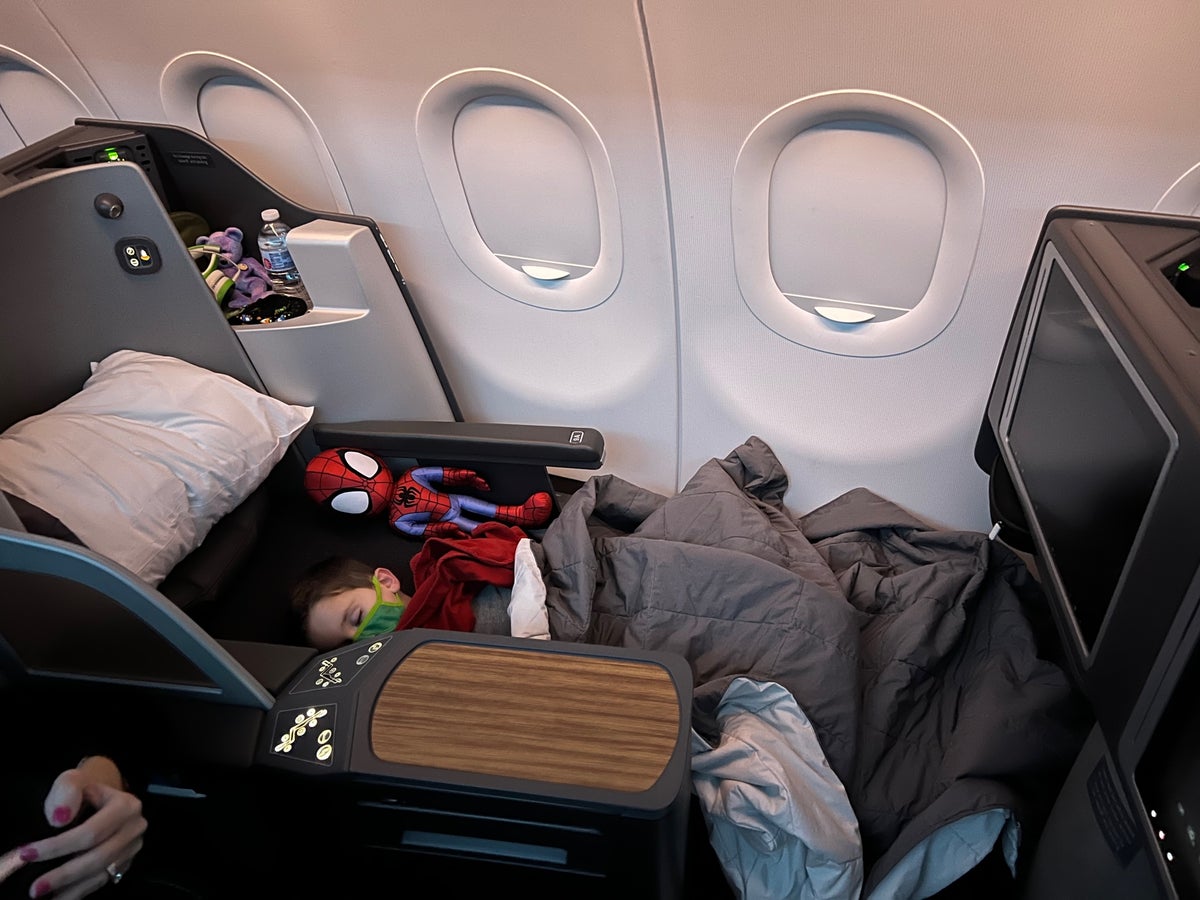 Child asleep American Airlines A321 business class