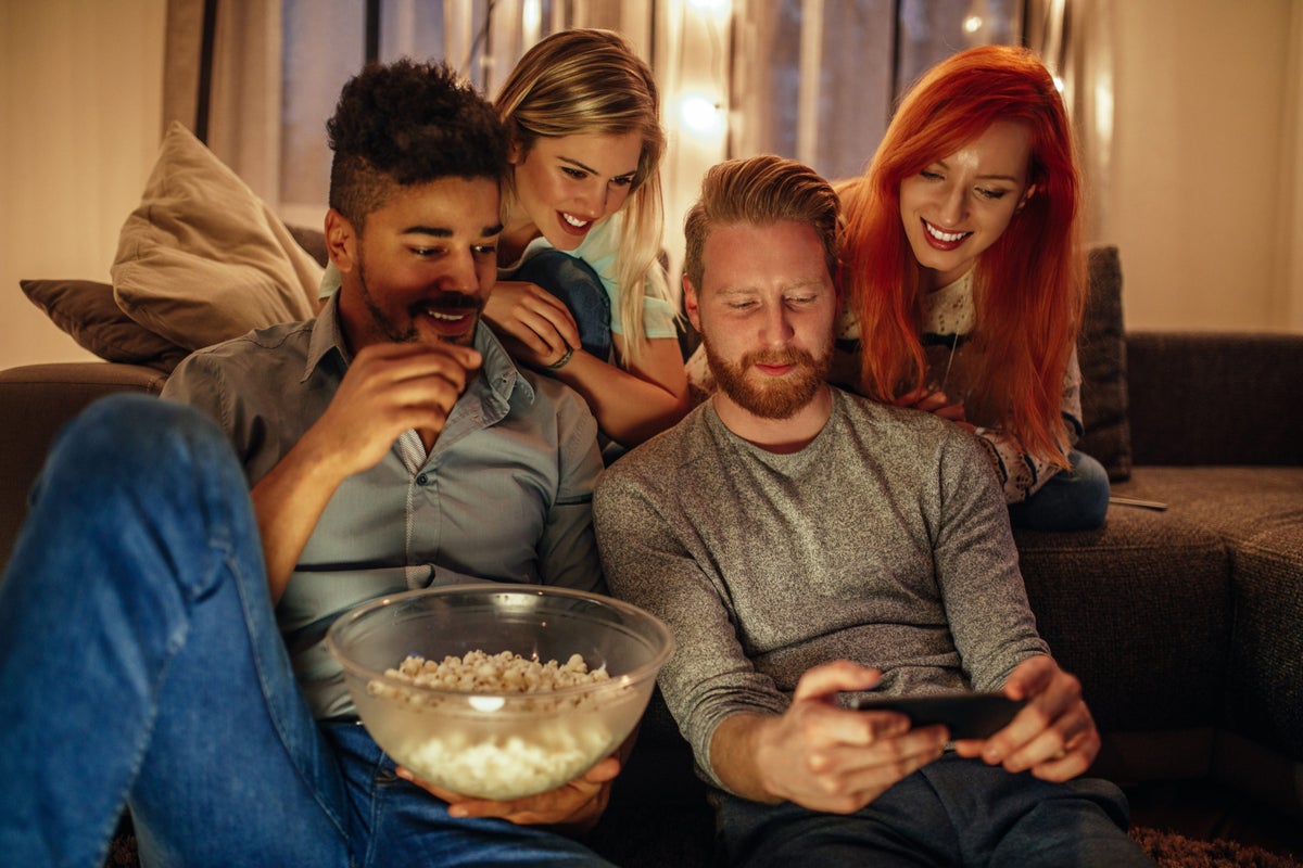 Friends watching streaming media on phone