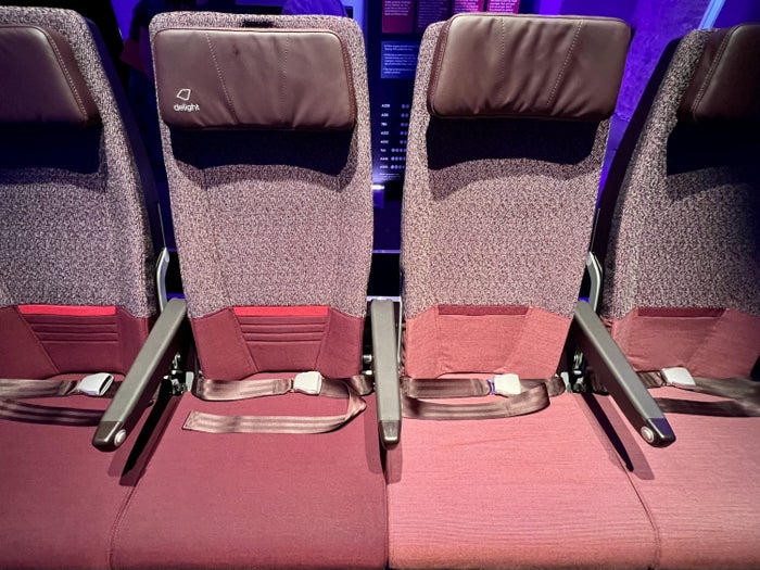 Side-by-side comparison of Virgin's Economy Delight and Economy Classic seats on an Airbus A330neo