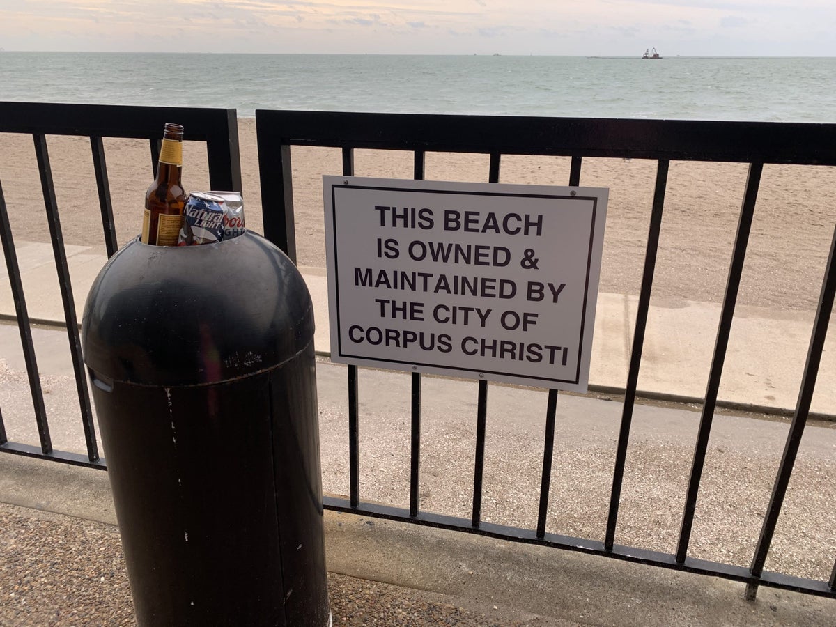 Sign about beach maintenance at DoubleTree by Hilton Corpus Christi Beachfront