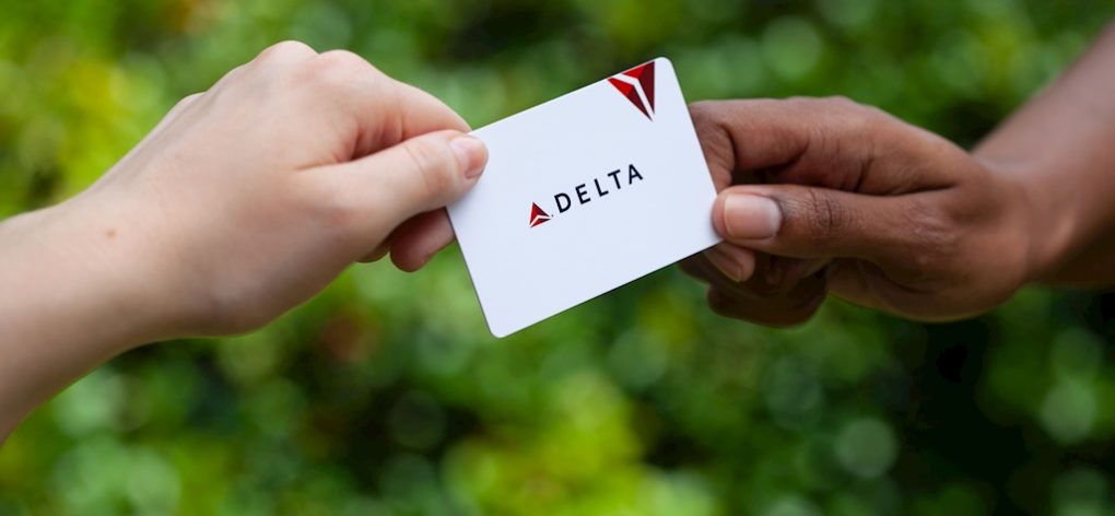 Delta gift card exchanging hands
