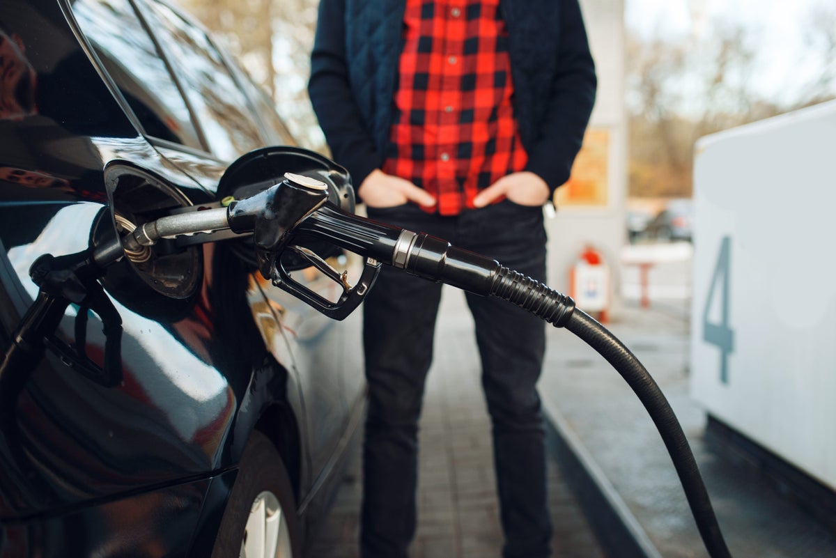 Man pumping gas black pump