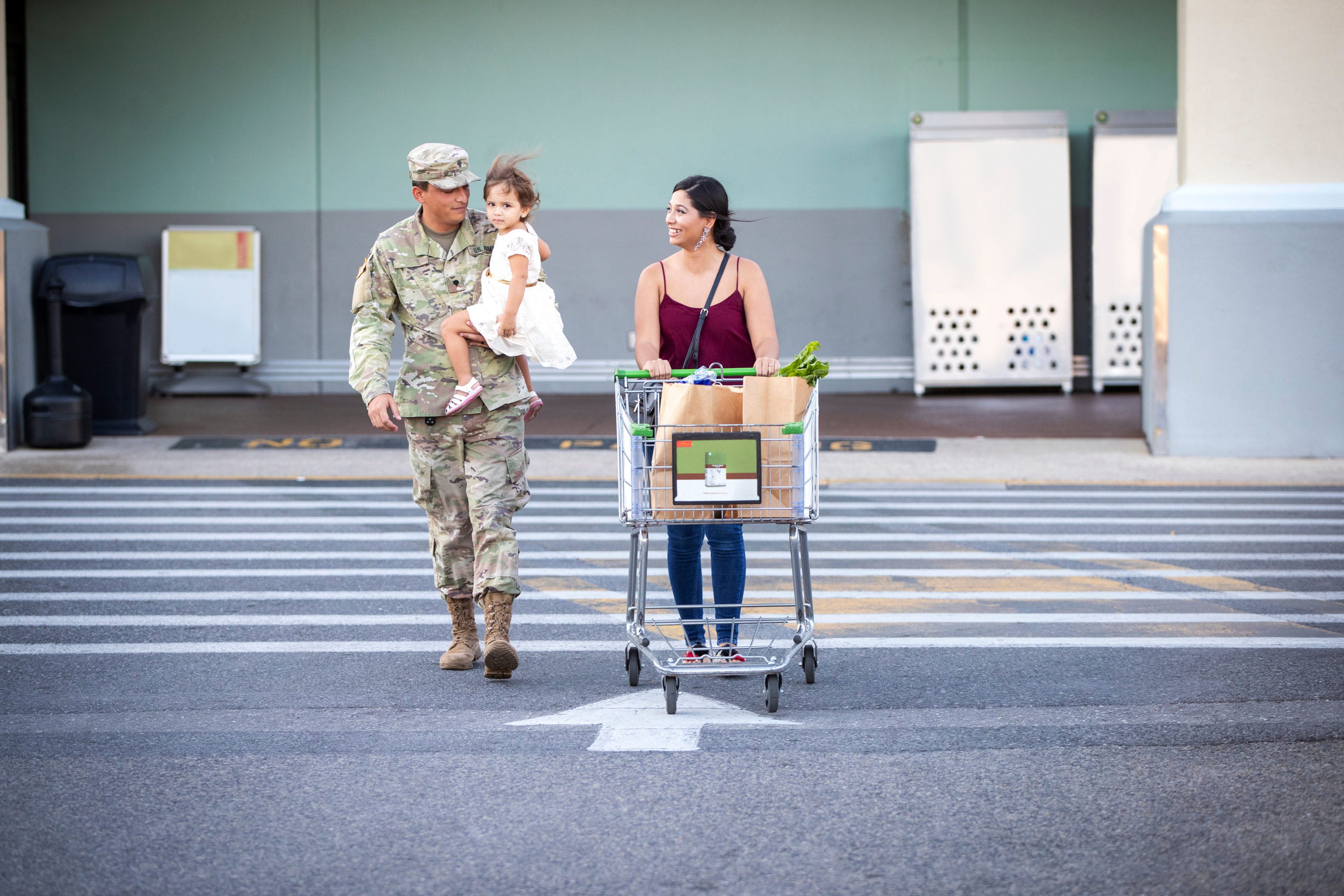 Soldier and his family buying groceries