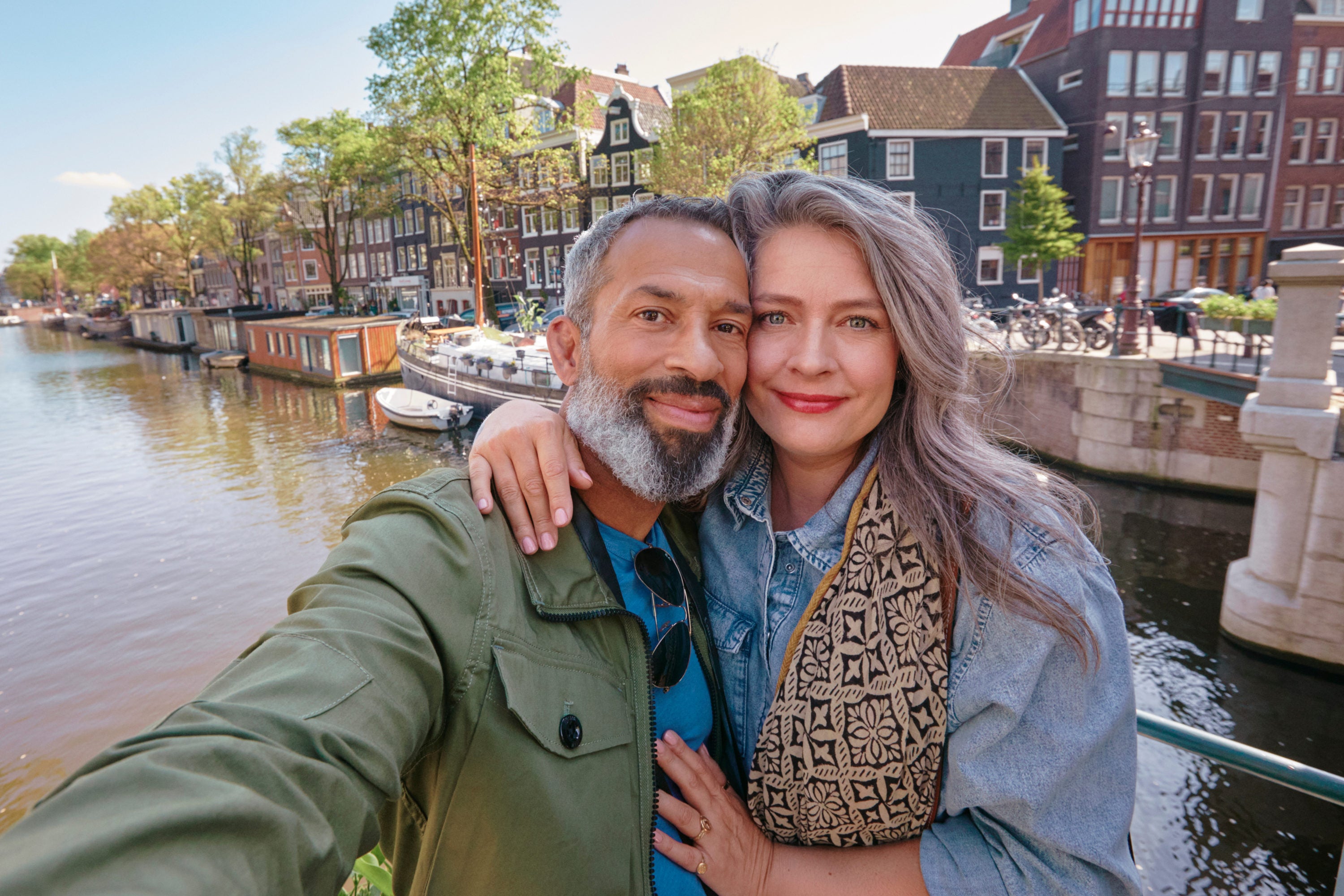 Couple takes selfie in front of canal