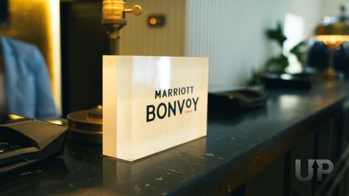 An image of the Marriott Bonvoy sign at the check-in counter.