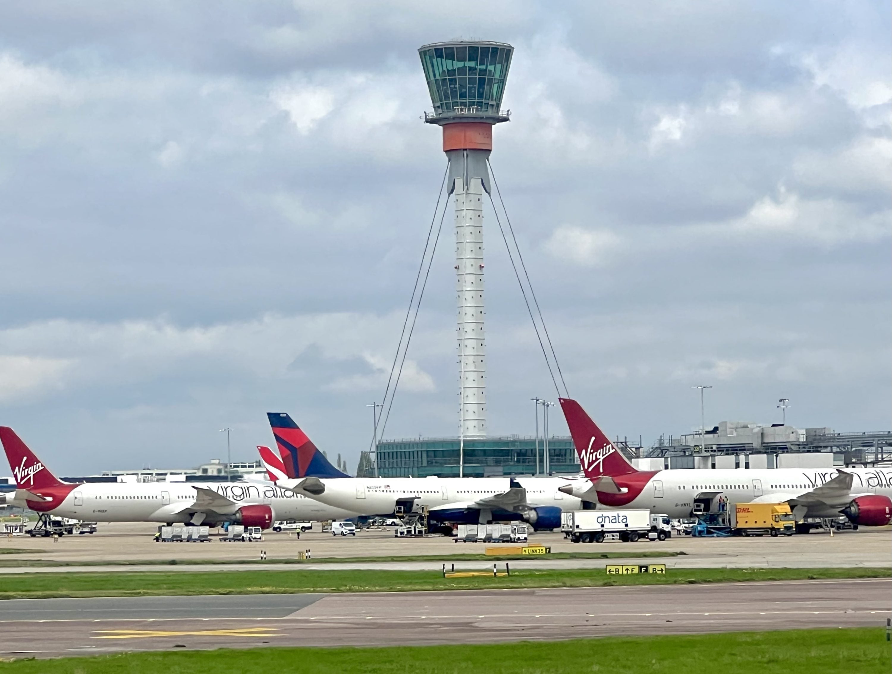 Virgin and Delta aircraft at London Heathrow Terminal 3
