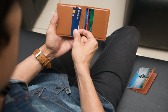 Man holding wallet with credit cards